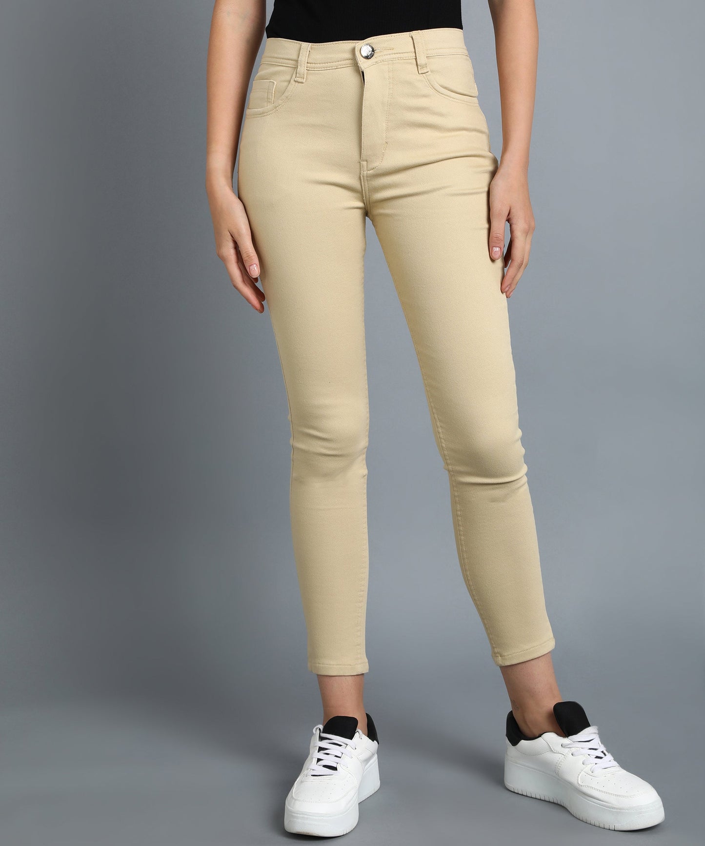 Beige slim fit 5- pocket high rise jeans, clean look, zip fly with button closure, waistband with belt loops