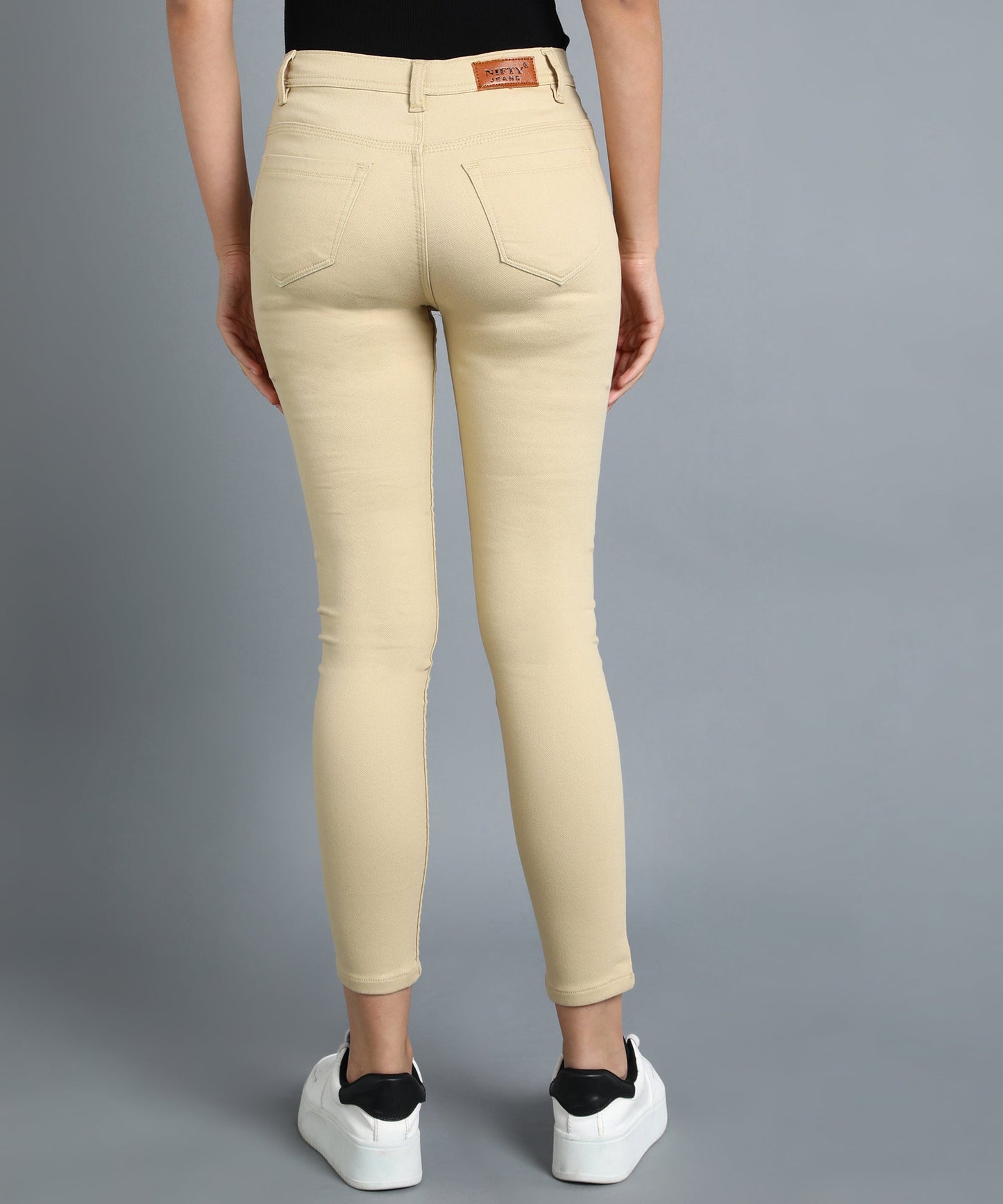 Beige slim fit 5- pocket high rise jeans, clean look, zip fly with button closure, waistband with belt loops