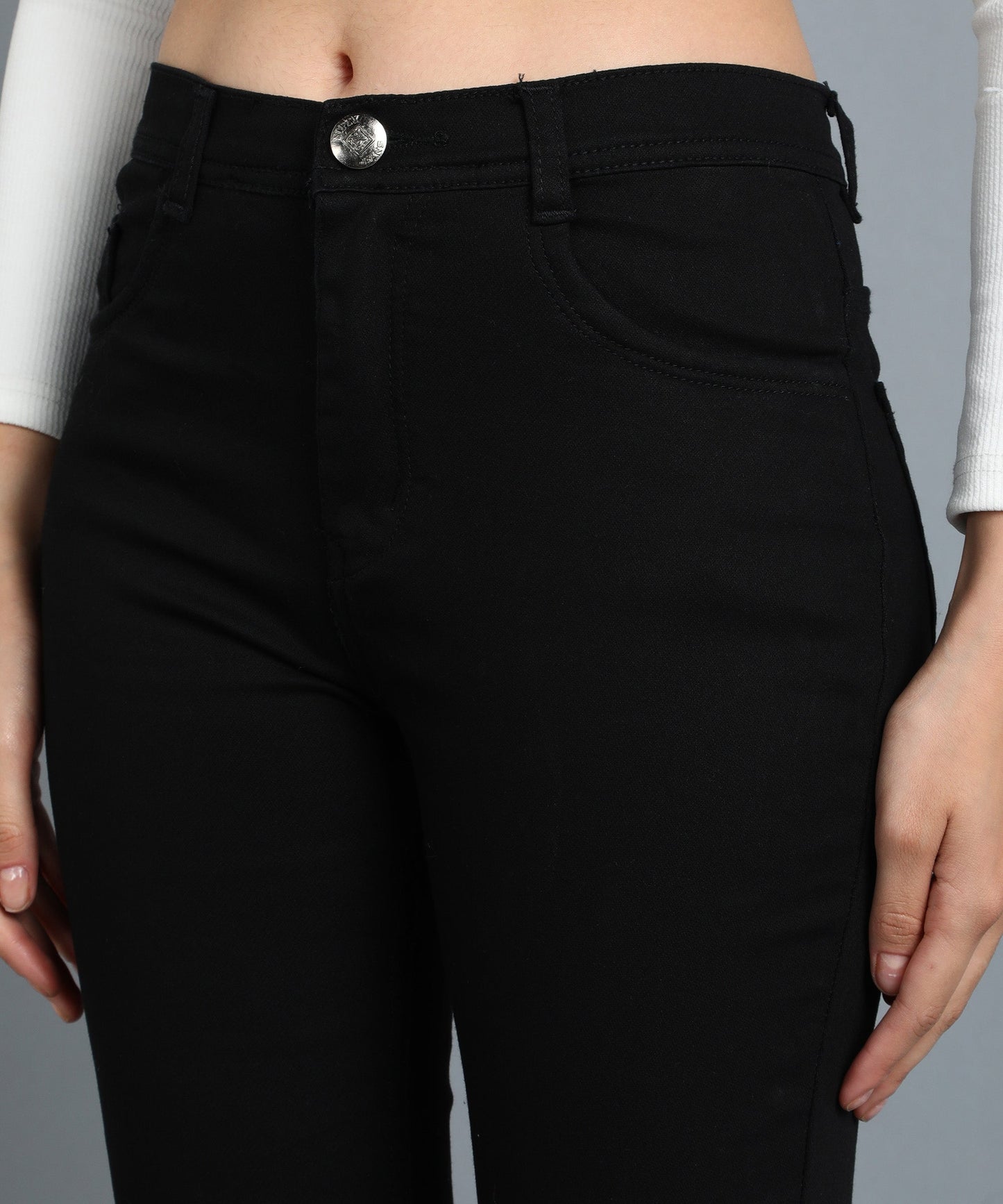 Jet black slim fit 5- pocket high rise jeans, clean look, zip fly with button closure, waistband with belt loops