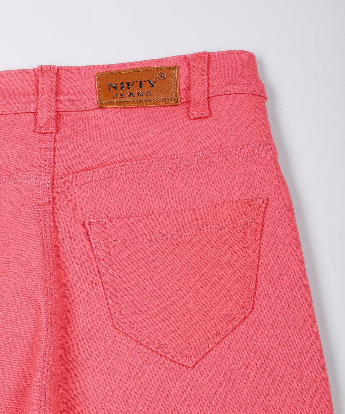 Red slim fit 5- pocket high rise jeans, clean look, zip fly with button closure, waistband with belt loops