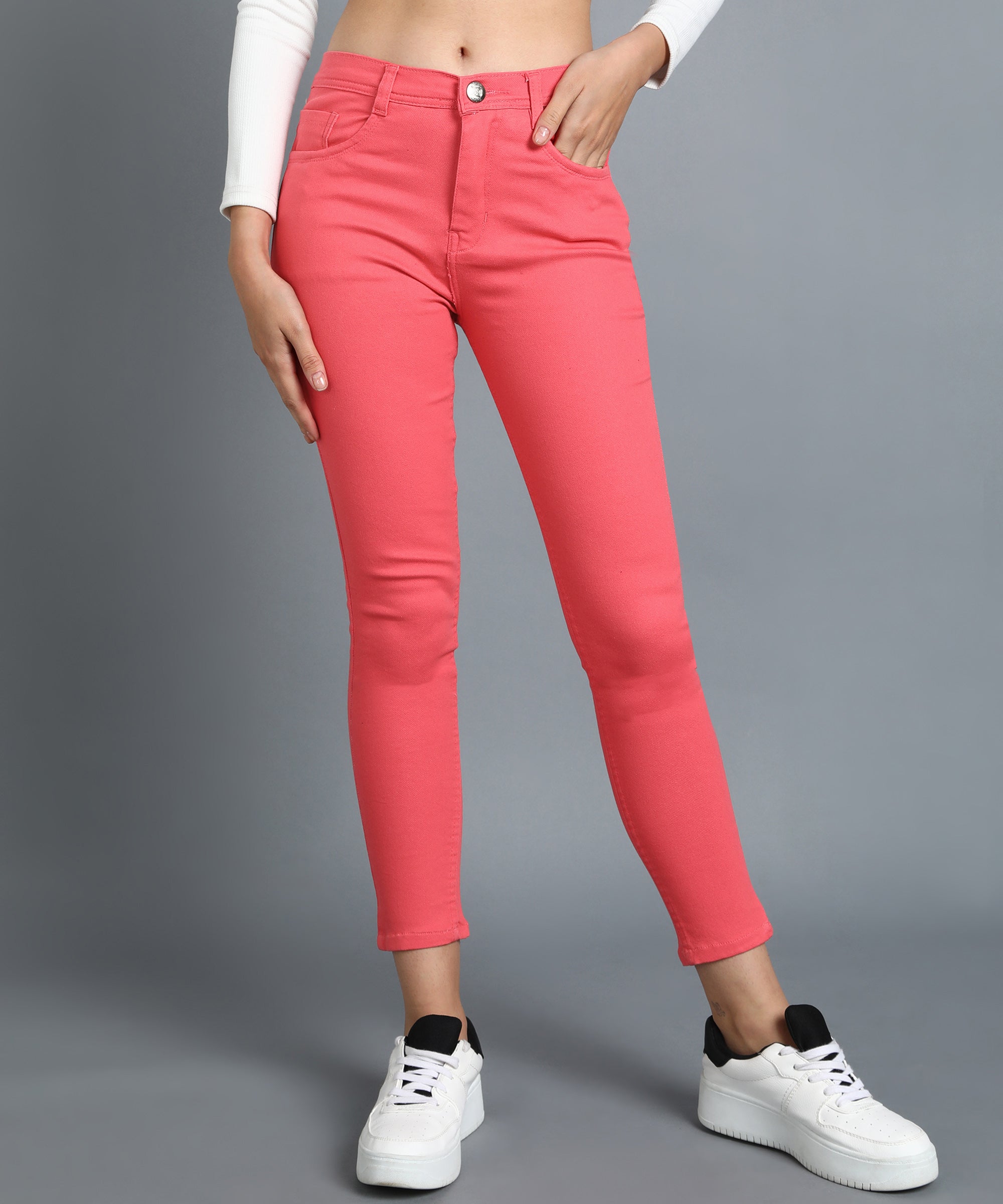 Red slim fit 5- pocket high rise jeans, clean look, zip fly with button closure, waistband with belt loops