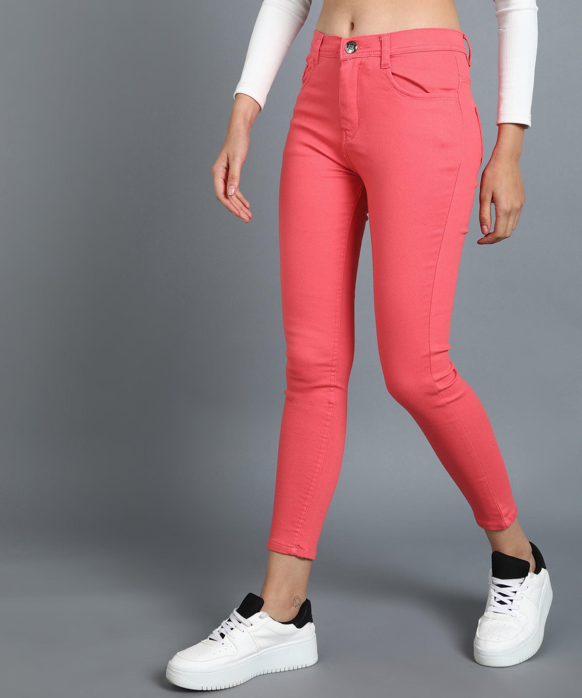 Red slim fit 5- pocket high rise jeans, clean look, zip fly with button closure, waistband with belt loops