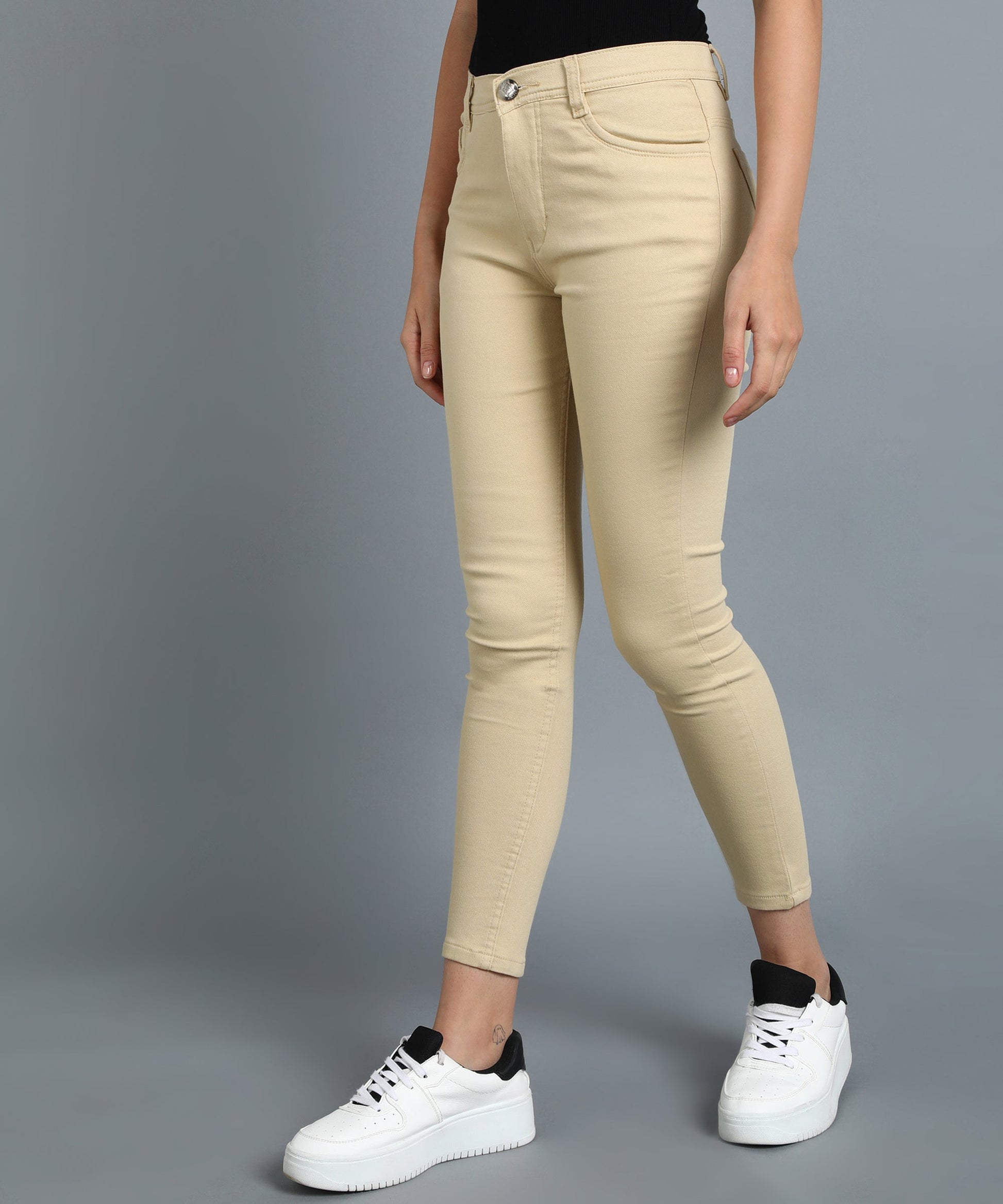 Beige slim fit 5- pocket high rise jeans, clean look, zip fly with button closure, waistband with belt loops
