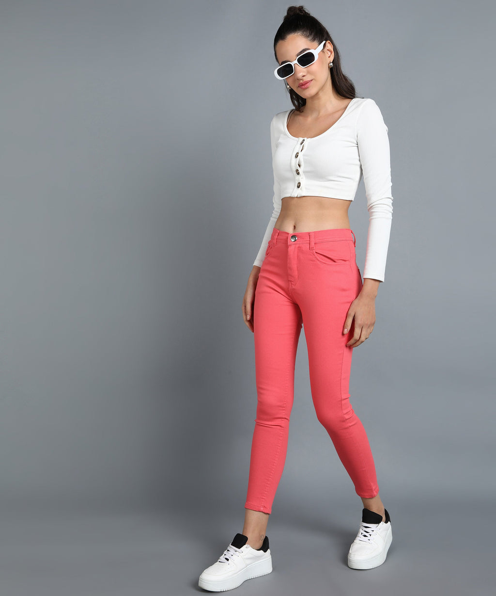 Red slim fit 5- pocket high rise jeans, clean look, zip fly with button closure, waistband with belt loops