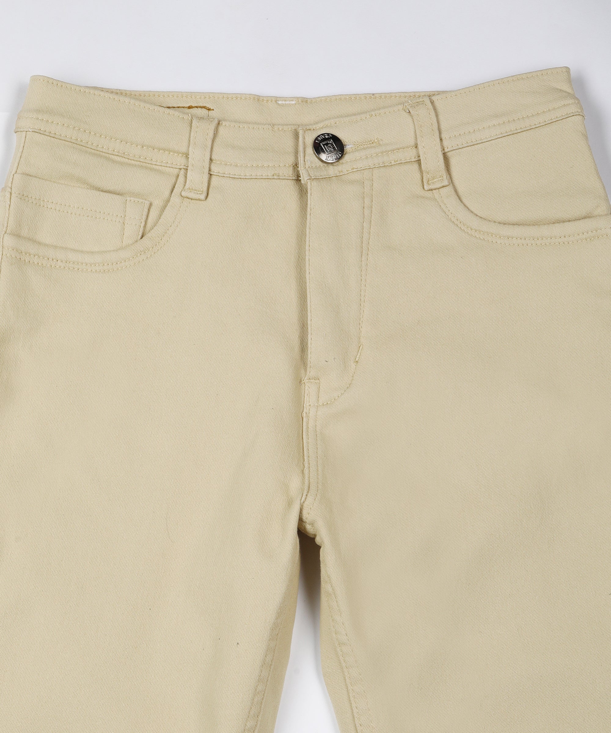 Beige slim fit 5- pocket high rise jeans, clean look, zip fly with button closure, waistband with belt loops